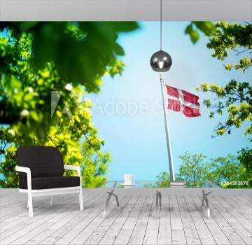 Bild på Denmark flag Danish flag waving in the wind between trees